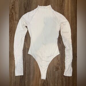 Naked Wardrobe Quarter Zip Bodysuit